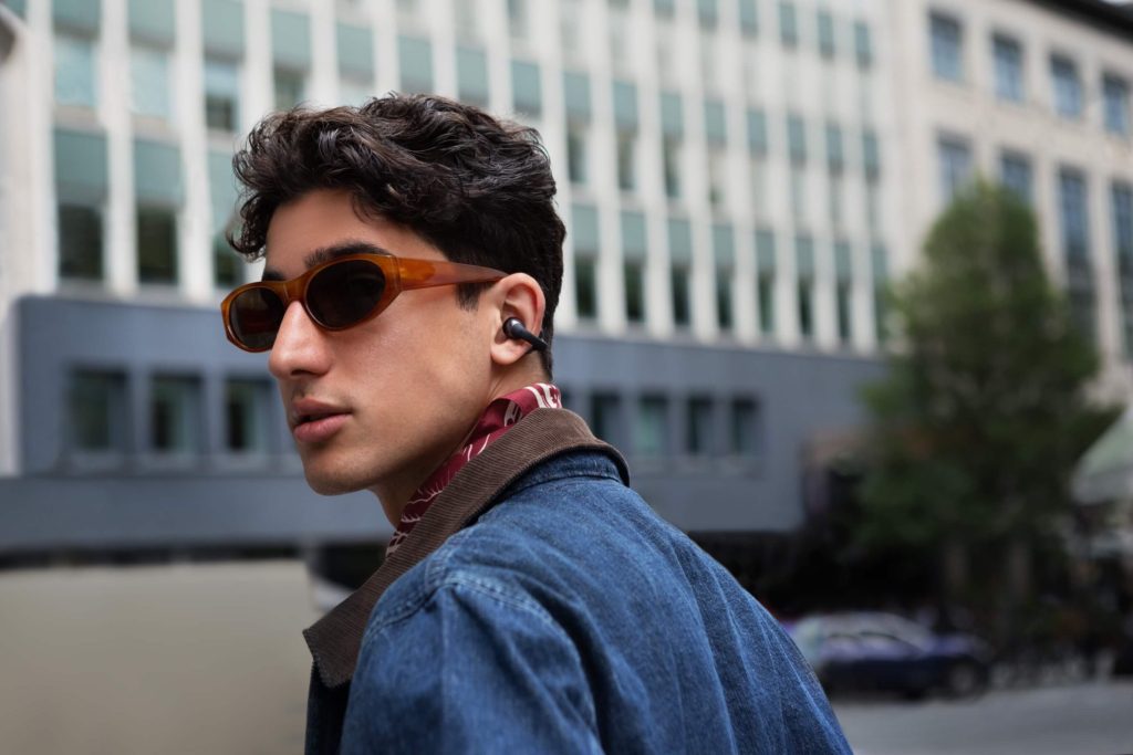 Male person wearing Shokz OpenDots ONE